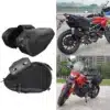 ALFORJAS LATERALES SEMIRRÍGIDAS TAICHI TIPO CARBÓN Las alforjas laterales TAICHI son la solución ideal para transportar tus pertenencias sin sacrificar estilo ni comodidad. Con diseño semirrígido tipo carbono, ofrecen un equilibrio perfecto entre estructura firme y flexibilidad, adaptándose tanto a viajes largos como al uso diario. Características: • Estructura semirrígida con acabado tipo carbono • Capacidad de 18 a 29 litros por alforja gracias a su sistema expandible • Medidas: 45 cm de largo x 30 cm de alto x 18 cm de ancho (expandible a 28 cm) • Amplio espacio para herramientas, documentos o casco • Cierres de alta calidad para mayor seguridad • Incluyen múltiples correas ajustables para una instalación firme y adaptable • Color disponible: negro • Funda impermeable incluida para proteger contra la lluvia y la suciedad Estas alforjas combinan funcionalidad y diseño, ideales para quienes buscan practicidad y estilo en cada ruta.